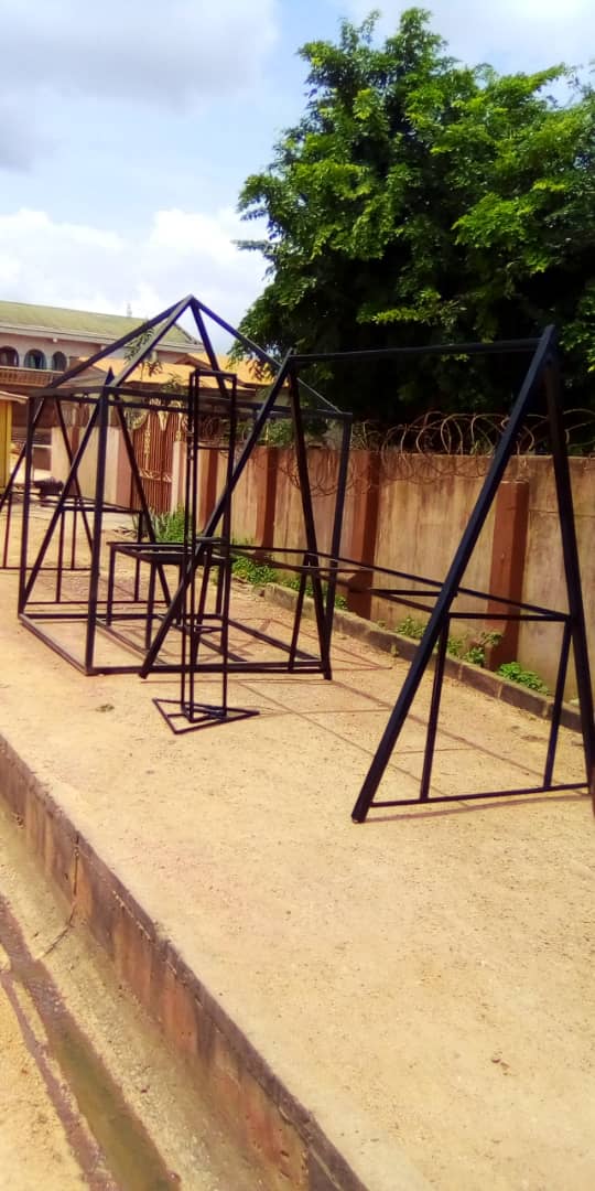 Product image -  Metal trusses, Iron gate, Burglar proof doors and windows, canopies, containers, metal steps, passico grades, works, metal chairs, flowers  holders, metal roofing, antique doors and chairs, and many more.....
